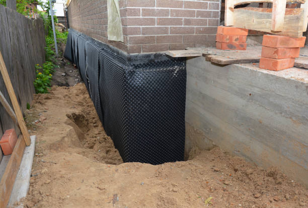 Happy homeowners after waterproofing job in Medinah